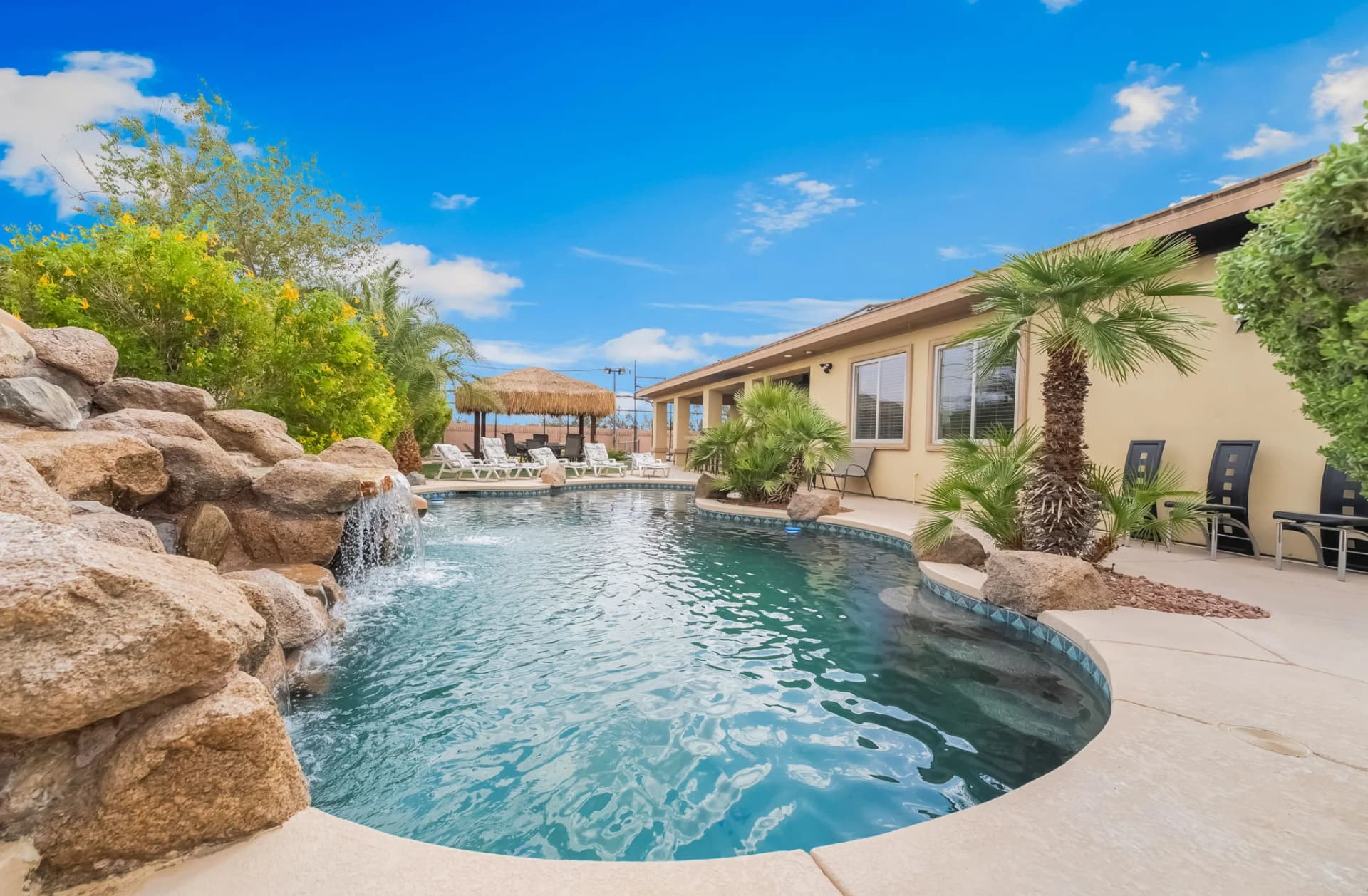 Pool and rear exterior of a gated mansion five minutes from the Strip